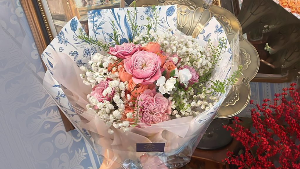A beautiful bouquet of pink, white and peach flowers.