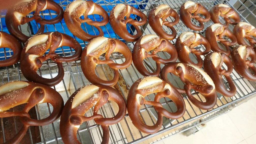 Salted pretzels on a cooling rack.
